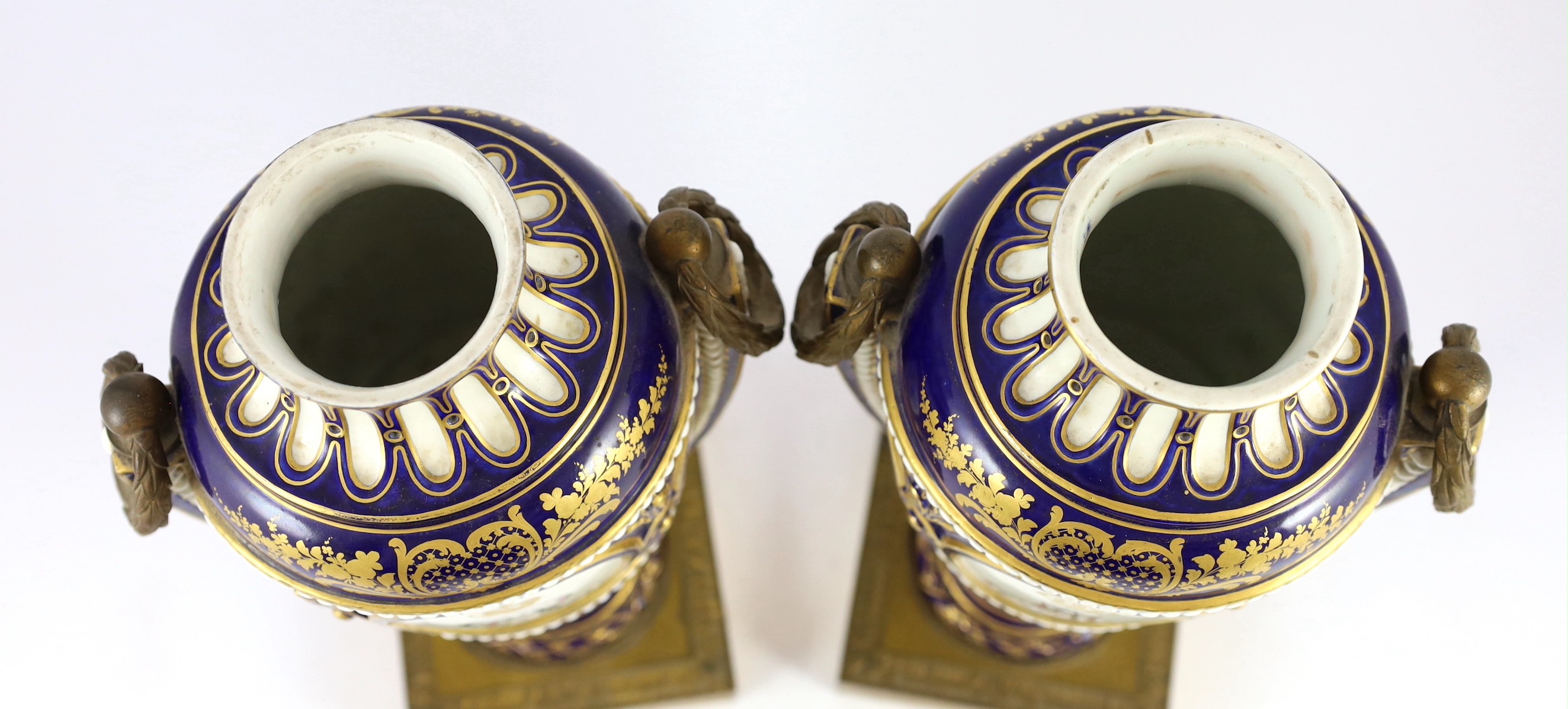 A pair of English porcelain Sevres style ormolu mounted vases and covers, mid 19th century, 44cm high, one replacement cover